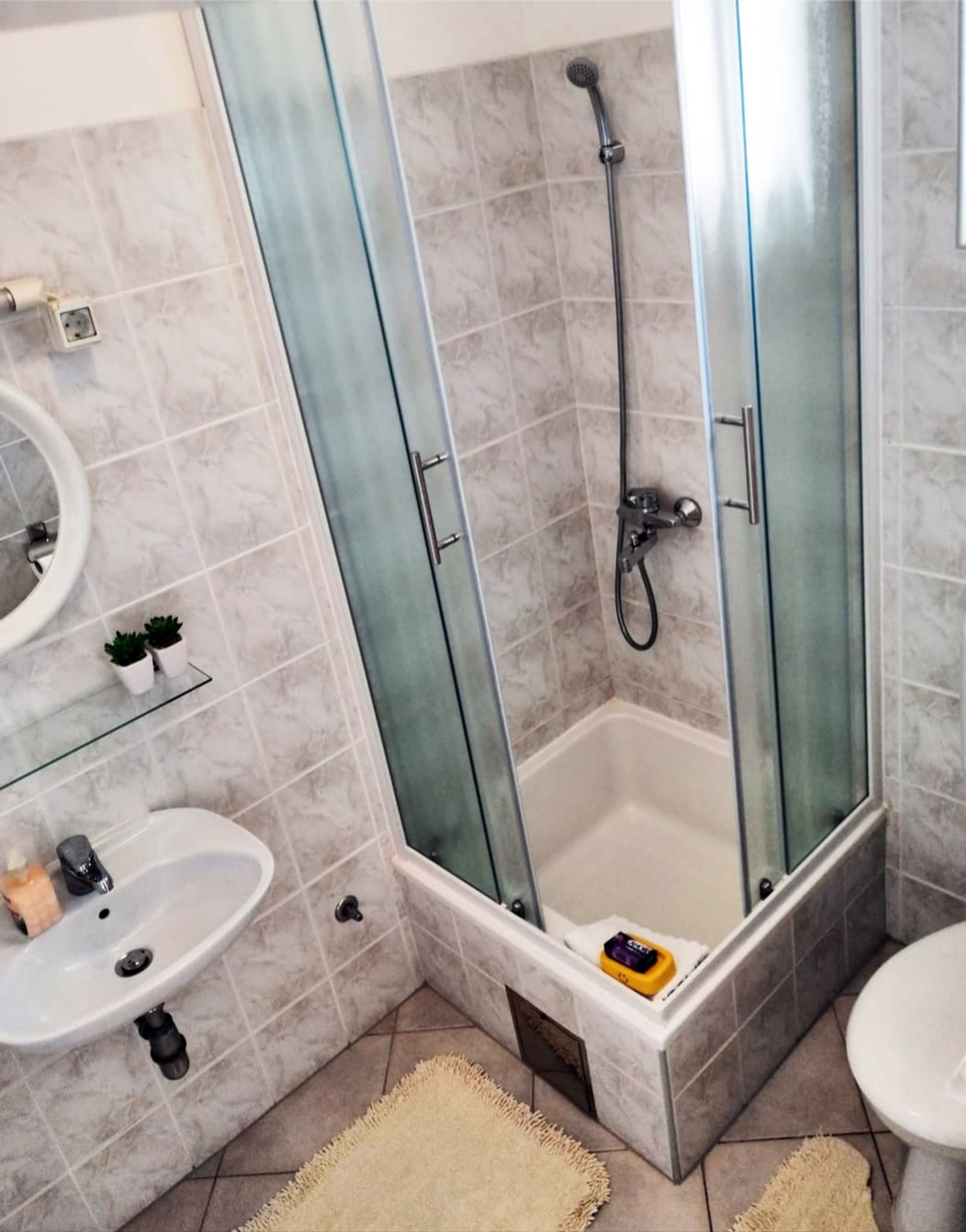 Apartment 2 bathroom with shower and vanity