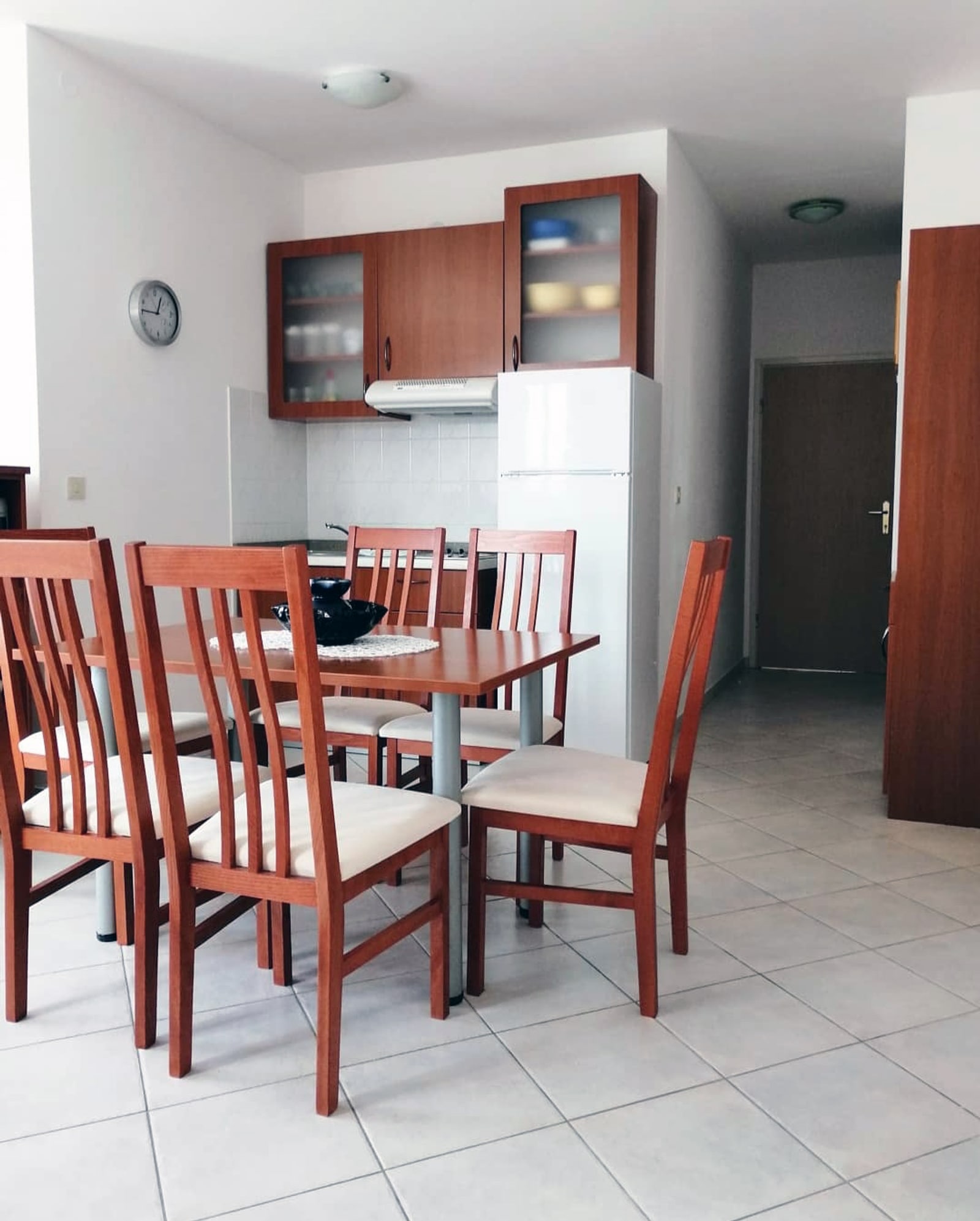 Apartment 3 kitchen area with cabinets and appliances