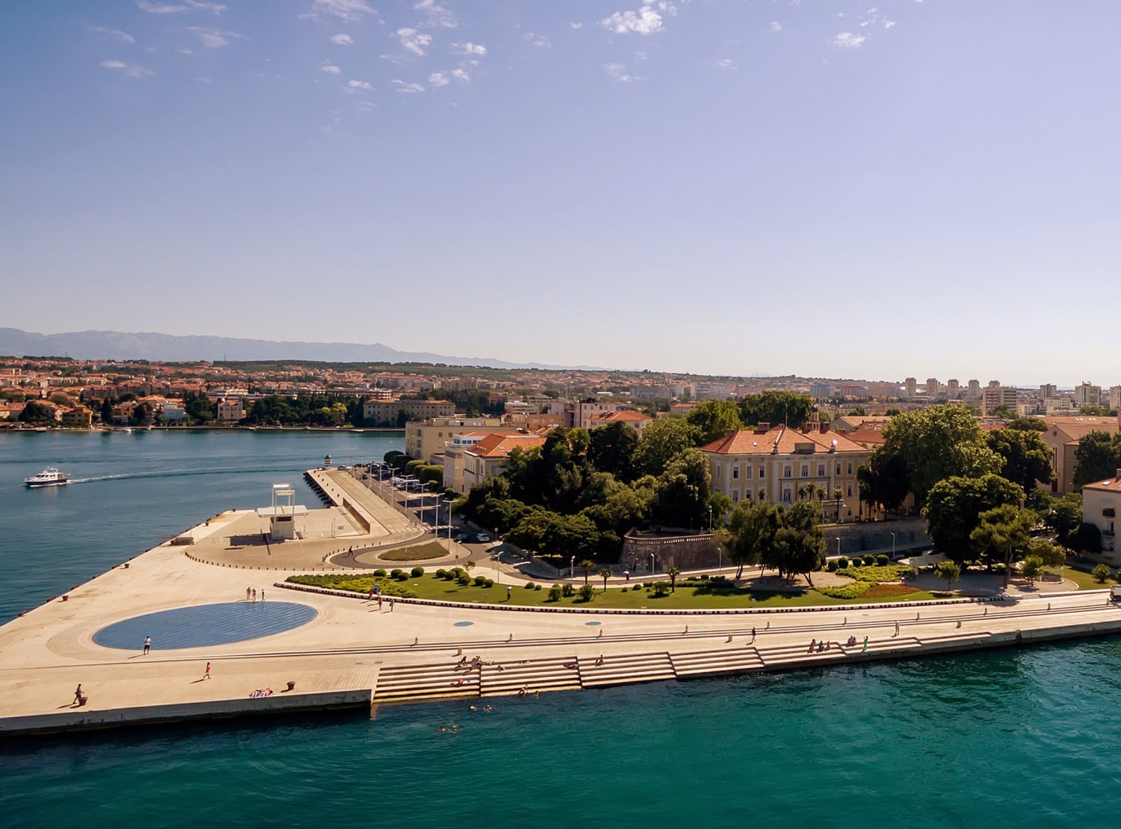 Sea Organ and Monument to the Sun on the Zadar waterfront at sunset